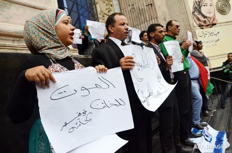Egyptians hold placards during a demonstration to protest against the normalizing Israeli-Egyptian relations in front of journalists syndicate in Cairo, Egypt, on March 02, 2016. Photo by Amr Sayed