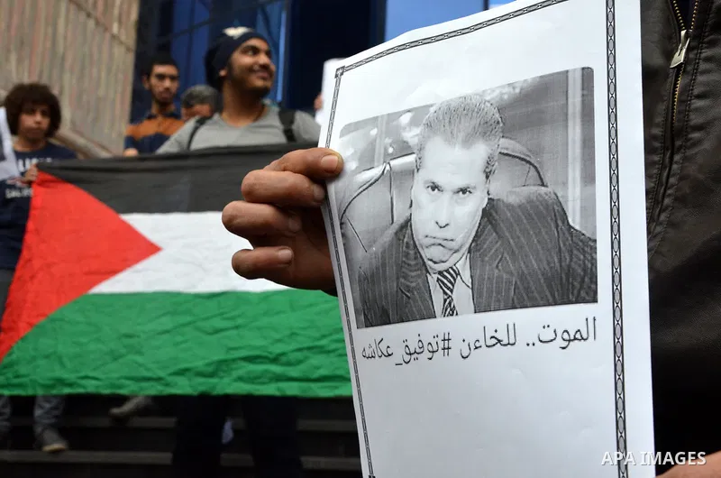 Egyptians hold placards during a demonstration to protest against the normalizing Israeli-Egyptian relations in front of journalists syndicate in Cairo, Egypt, on March 02, 2016. Photo by Amr Sayed
