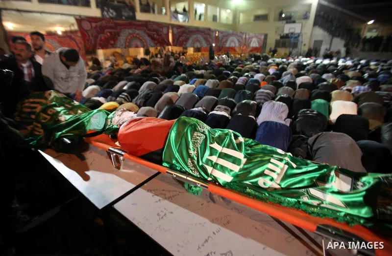 Palestinians carry the bodies of Mohammad Hashem and Labib Azem during their funeral in the West Bank city of Nablus March 2, 2016. Israeli soldiers shot dead the two Palestinian teens who had attacked an Israeli settler...