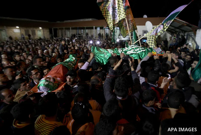 Palestinians carry the bodies of Mohammad Hashem and Labib Azem during their funeral in the West Bank city of Nablus March 2, 2016. Israeli soldiers shot dead the two Palestinian teens who had attacked an Israeli settler...