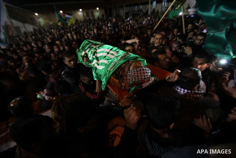 Palestinians carry the bodies of Mohammad Hashem and Labib Azem during their funeral in the West Bank city of Nablus March 2, 2016. Israeli soldiers shot dead the two Palestinian teens who had attacked an Israeli settler...