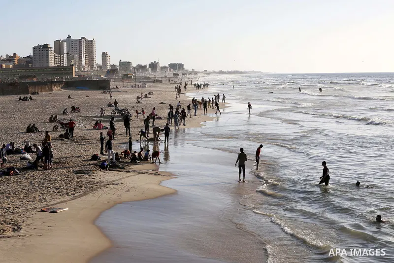 Palestinians enjoy a day at the beach of the Mediterranean Sea on the coast of Gaza City, on March 04, 2016. Photo by Mohammed Asad
