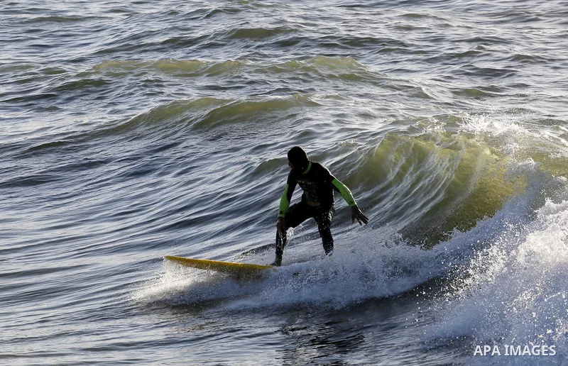 Palestinian youth enjoy water skiing in the Mediterranean Sea in Gaza City on on March 04, 2016. Photo by Mohammed Asad