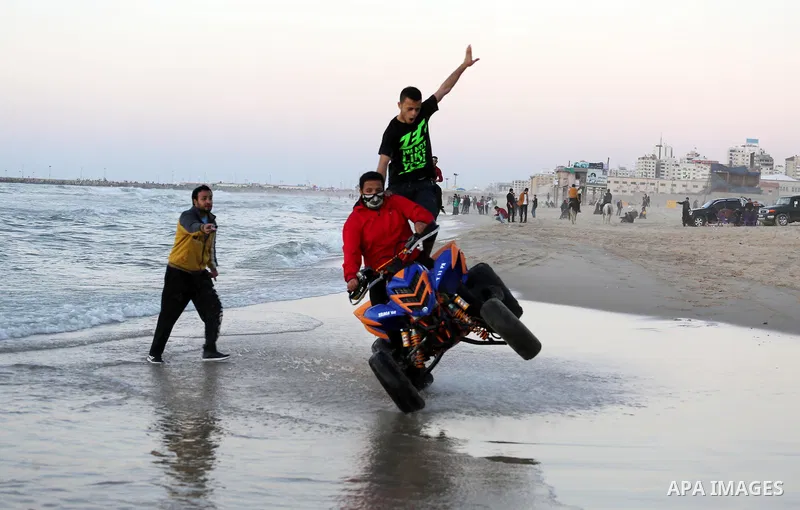 Palestinians enjoy a day at the beach of the Mediterranean Sea on the coast of Gaza City, on March 04, 2016. Photo by Mohammed Asad