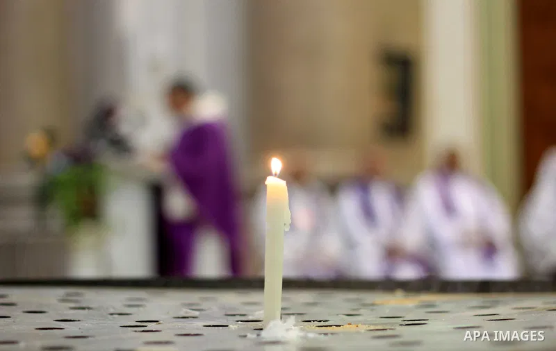 Clergymen pray before the altar in memory of Italian PhD student Guilio Regeni, who was tortured and killed in the capital in January, at Saint Joseph's Roman Catholic Church in Cairo, Egypt March 5, 2016. Photo by Amr S...
