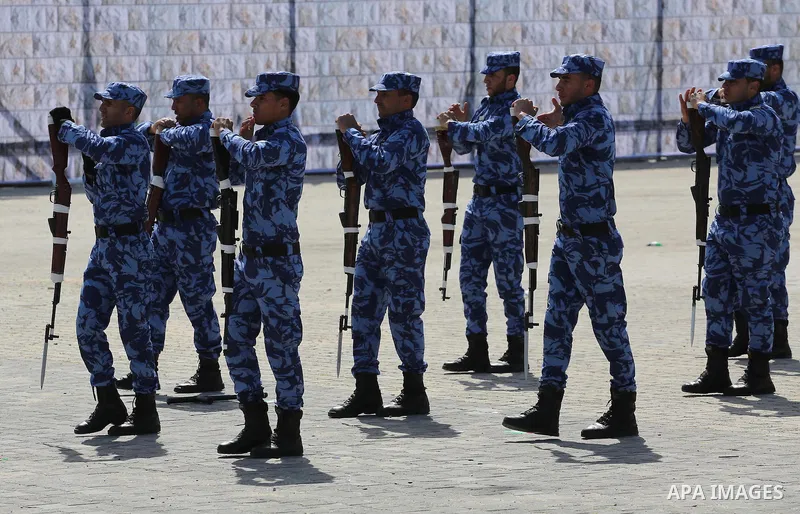 Palestinian members of officers display their skills during a graduation ceremony, in Gaza city, on March 6, 2016. Photo by Mohammed Asad