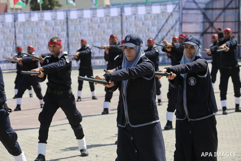 Palestinian members of officers display their skills during a graduation ceremony, in Gaza city, on March 6, 2016. Photo by Mohammed Asad