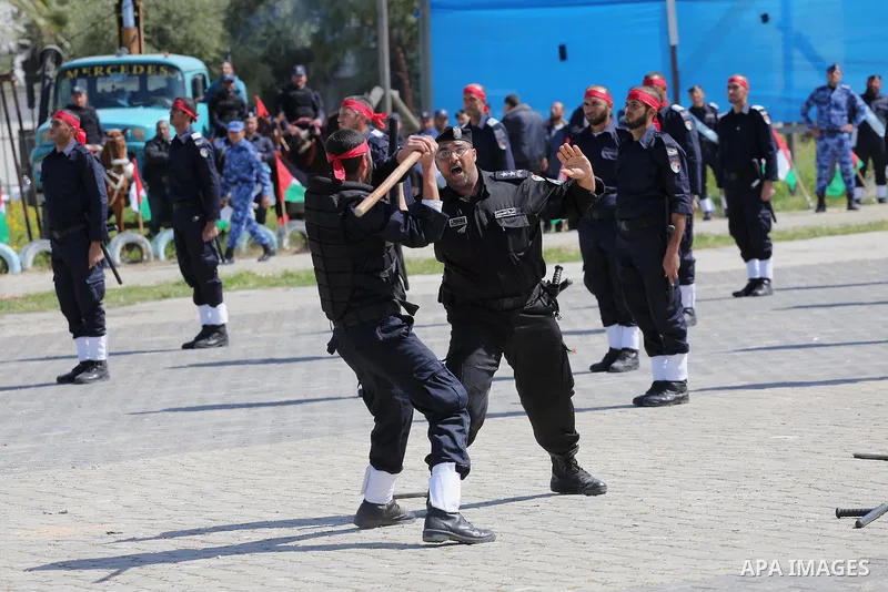 Palestinian members of officers display their skills during a graduation ceremony, in Gaza city, on March 6, 2016. Photo by Mohammed Asad