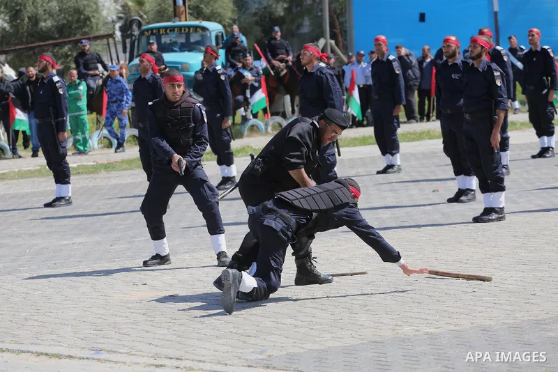 Palestinian members of officers display their skills during a graduation ceremony, in Gaza city, on March 6, 2016. Photo by Mohammed Asad