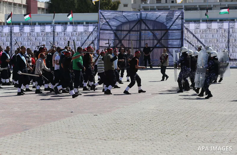 Palestinian members of officers display their skills during a graduation ceremony, in Gaza city, on March 6, 2016. Photo by Mohammed Asad