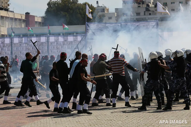 Palestinian members of officers display their skills during a graduation ceremony, in Gaza city, on March 6, 2016. Photo by Mohammed Asad