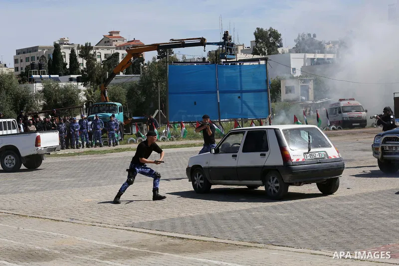 Palestinian members of officers display their skills during a graduation ceremony, in Gaza city, on March 6, 2016. Photo by Mohammed Asad