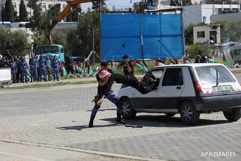 Palestinian members of officers display their skills during a graduation ceremony, in Gaza city, on March 6, 2016. Photo by Mohammed Asad