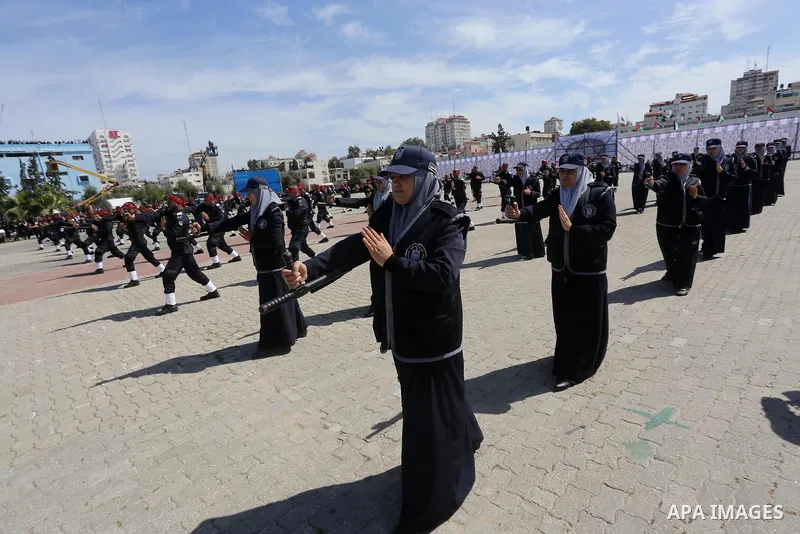 Palestinian members of officers display their skills during a graduation ceremony, in Gaza city, on March 6, 2016. Photo by Mohammed Asad