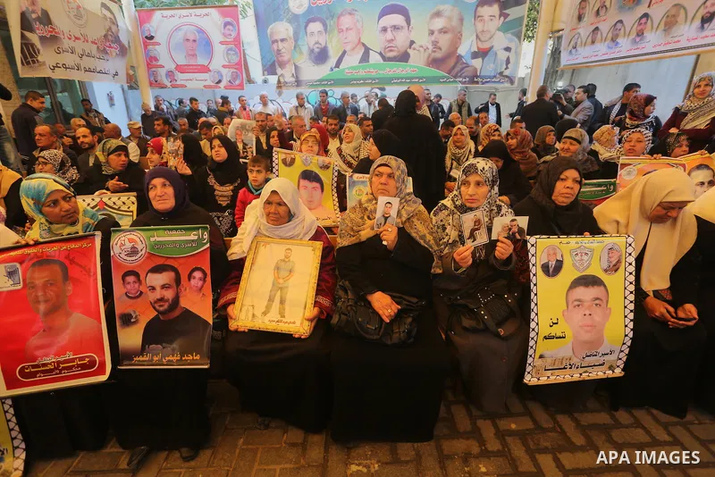 Palestinians take part in a protest demanding release the prisoners in Israeli jails, in front of Red cross office, in Gaza city, on March 7, 2016. Photo by Mohammed Asad
