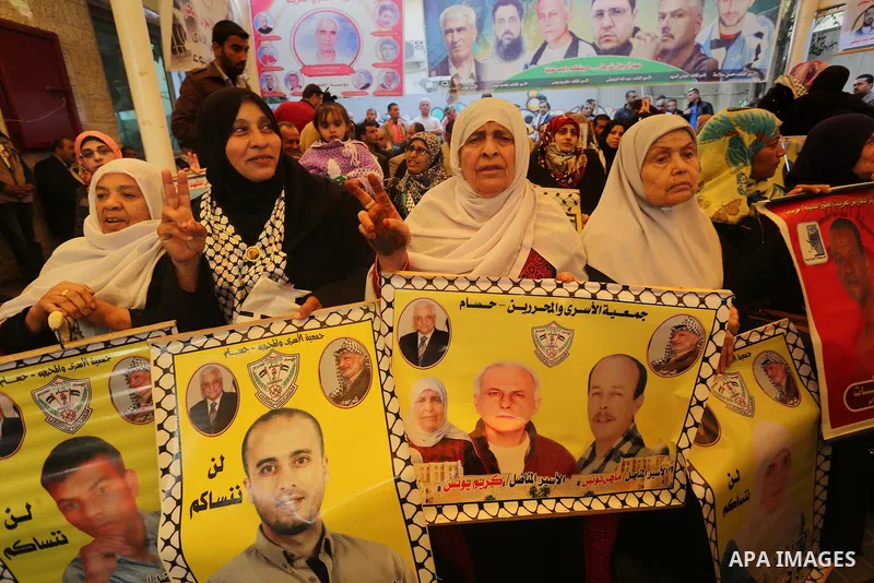 Palestinians take part in a protest demanding release the prisoners in Israeli jails, in front of Red cross office, in Gaza city, on March 7, 2016. Photo by Mohammed Asad