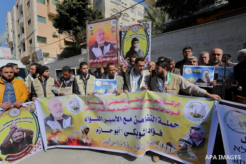 Palestinians take part in a protest demanding release the prisoners in Israeli jails, in front of Red cross office, in Gaza city, on March 7, 2016. Photo by Mohammed Asad