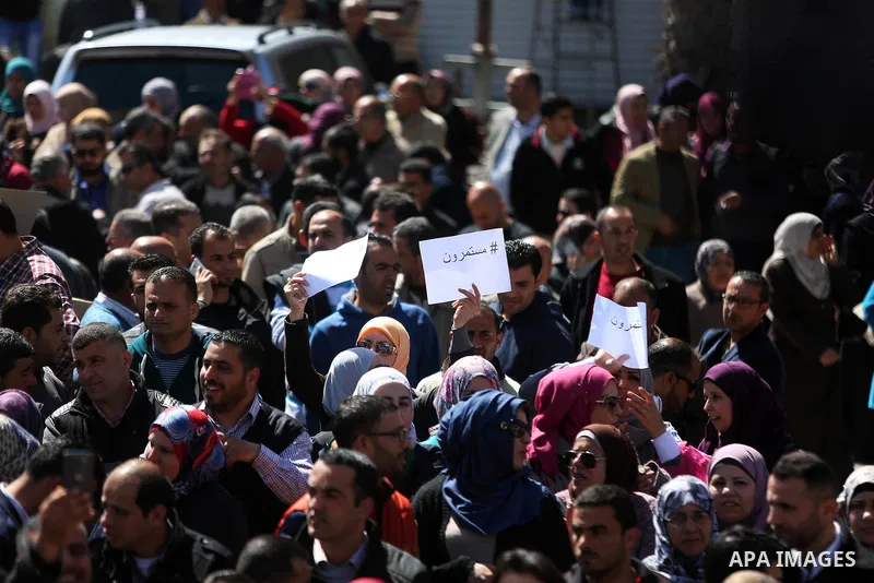 Palestinian teachers take part in a protest to demand their rights in front of the headquarters of the Council of Ministers, in the West bank city of Ramallah, March7, 2016. Photo by Shadi Hatem
