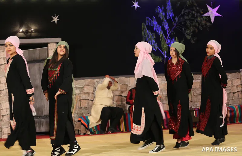 Palestinians take part in a celebrate on the occasion of International Women's Day in Gaza City on March 7, 2016. Photo by Mohammed Asad