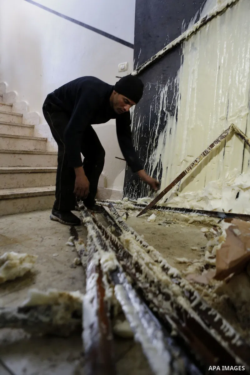 Palestinians check the damage house of Ibrahim Skafi that was demolished by the Israeli army in the West Bank city of Hebron March 8, 2016. Skafi was shot dead after he rammed an Israeli soldiers in Halhul north of Hebro...