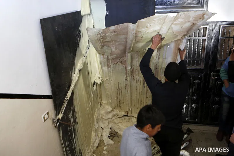 Palestinians check the damage house of Ibrahim Skafi that was demolished by the Israeli army in the West Bank city of Hebron March 8, 2016. Skafi was shot dead after he rammed an Israeli soldiers in Halhul north of Hebro...