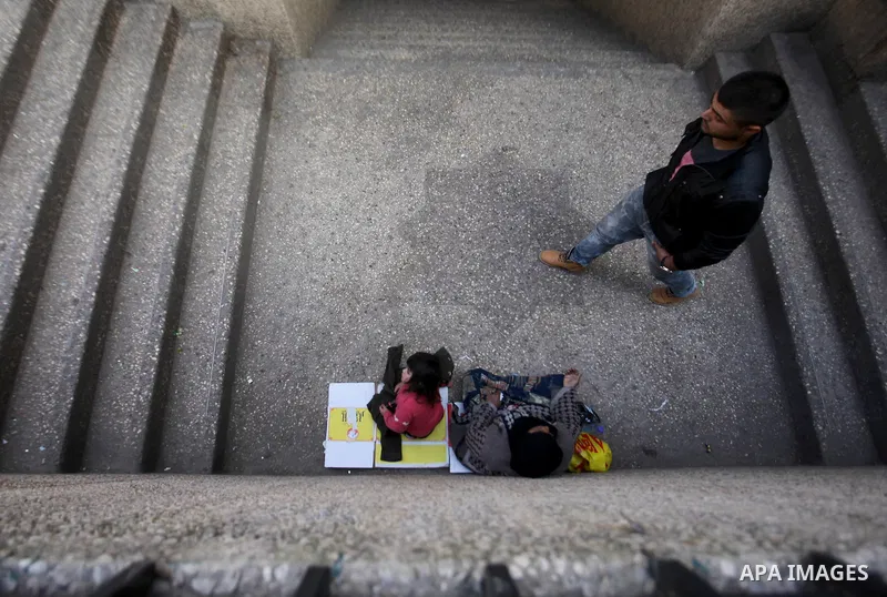A Palestinian woman begging in the streets, in the West Bank city of Nablus, on March 8, 2016. People around the globe celebrate International Women's Day, which dates back to the beginning of the 20th Century and has be...