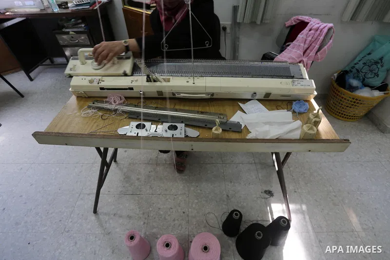Palestinian women work on embroidery on the occasion of International Women's Day in Gaza City on March 8, 2016. People around the globe celebrate International Women's Day, which dates back to the beginning of the 20th...
