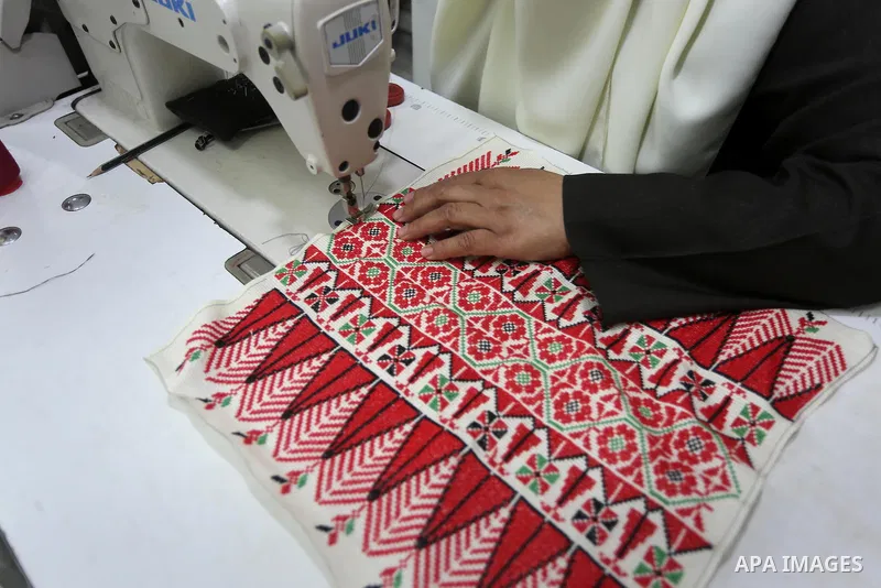 Palestinian women work on embroidery on the occasion of International Women's Day in Gaza City on March 8, 2016. People around the globe celebrate International Women's Day, which dates back to the beginning of the 20th...