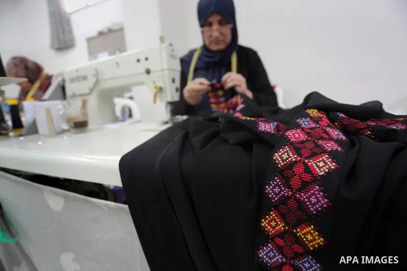 Palestinian women work on embroidery on the occasion of International Women's Day in Gaza City on March 8, 2016. People around the globe celebrate International Women's Day, which dates back to the beginning of the 20th...