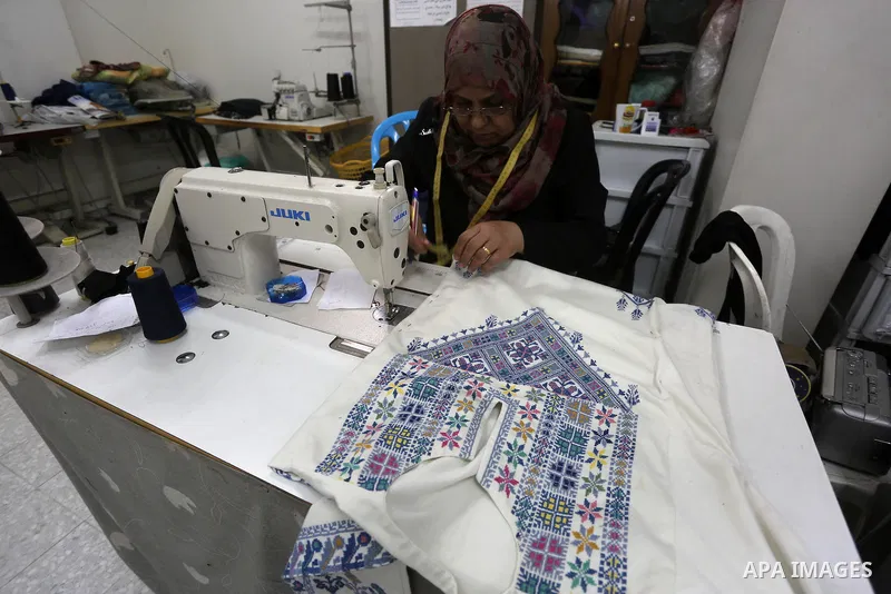 Palestinian women work on embroidery on the occasion of International Women's Day in Gaza City on March 8, 2016. People around the globe celebrate International Women's Day, which dates back to the beginning of the 20th...