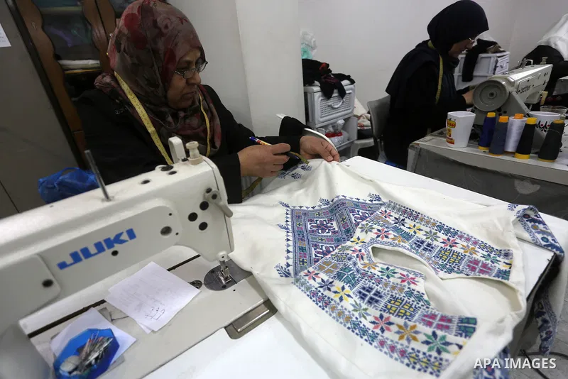 Palestinian women work on embroidery on the occasion of International Women's Day in Gaza City on March 8, 2016. People around the globe celebrate International Women's Day, which dates back to the beginning of the 20th...