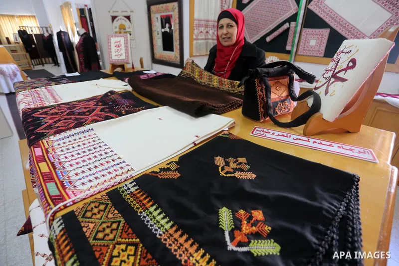 Palestinian women work on embroidery on the occasion of International Women's Day in Gaza City on March 8, 2016. People around the globe celebrate International Women's Day, which dates back to the beginning of the 20th...