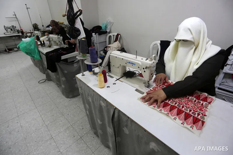 Palestinian women work on embroidery on the occasion of International Women's Day in Gaza City on March 8, 2016. People around the globe celebrate International Women's Day, which dates back to the beginning of the 20th...