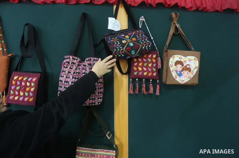 Palestinian women work on embroidery on the occasion of International Women's Day in Gaza City on March 8, 2016. People around the globe celebrate International Women's Day, which dates back to the beginning of the 20th...
