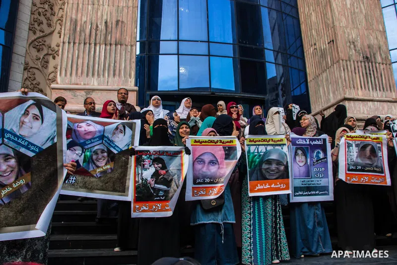 Relatives of prisoned journalists shout slogans during a protest demanding the release of imprisoned journalists, in front the Egyptian Press Union building in Cairo, Egypt, on March 08, 2016. Photo by Amr Sayed