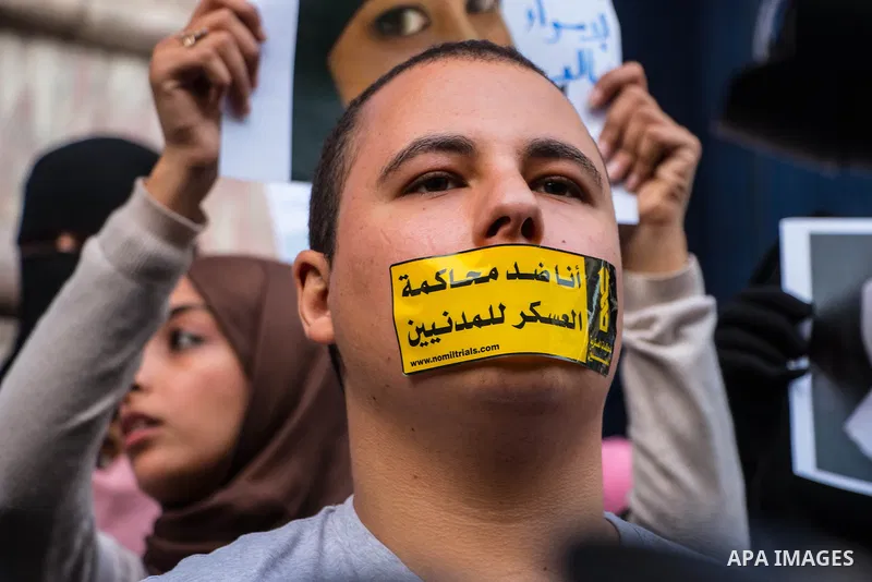 Relatives of prisoned journalists shout slogans during a protest demanding the release of imprisoned journalists, in front the Egyptian Press Union building in Cairo, Egypt, on March 08, 2016. Photo by Amr Sayed