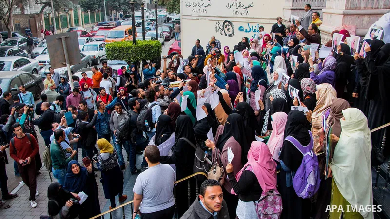 Relatives of prisoned journalists shout slogans during a protest demanding the release of imprisoned journalists, in front the Egyptian Press Union building in Cairo, Egypt, on March 08, 2016. Photo by Amr Sayed