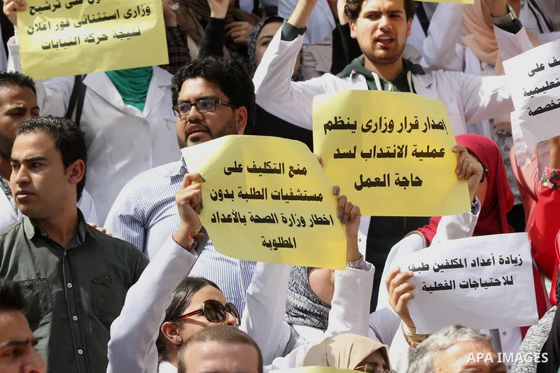 Egyptian Doctors take part in a protest to demanding their rights, in Cairo, Egypt, on March 9, 2016. Photo by Amr Sayed