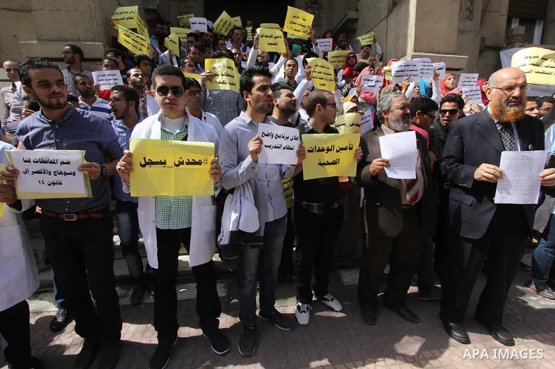 Egyptian Doctors take part in a protest to demanding their rights, in Cairo, Egypt, on March 9, 2016. Photo by Amr Sayed