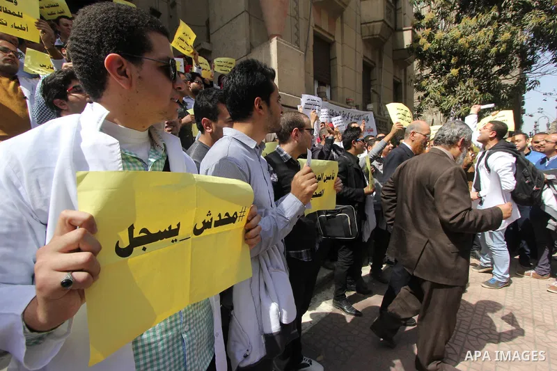 Egyptian Doctors take part in a protest to demanding their rights, in Cairo, Egypt, on March 9, 2016. Photo by Amr Sayed