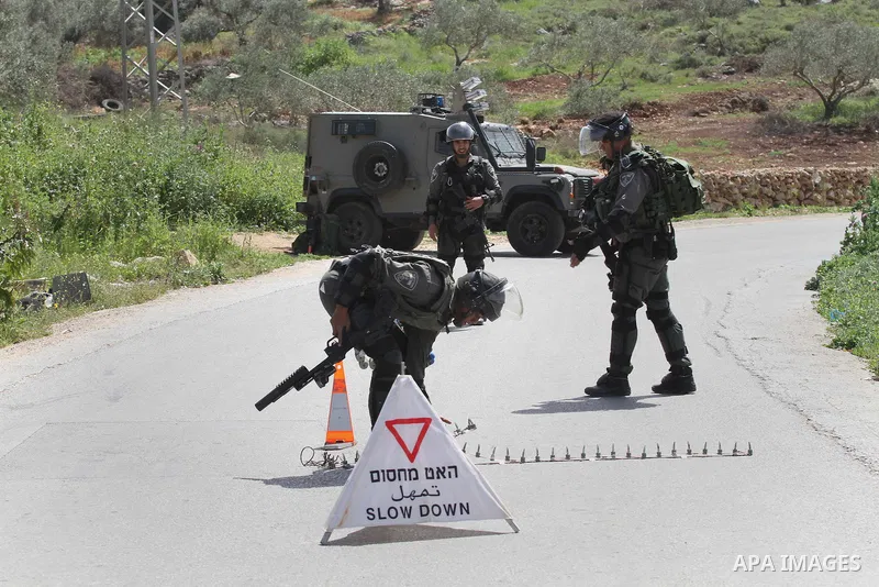 Israeli police gather at the scene of a stabbing attack in the West Bank village of Salfit, 09 March 2016. Israeli forces shot dead a 16-year-old Palestinian boy after he attempted to carry out a stabbing attack at a mil...