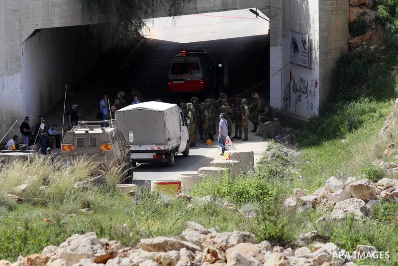 Israeli police gather at the scene of a stabbing attack in the West Bank village of Salfit, 09 March 2016. Israeli forces shot dead a 16-year-old Palestinian boy after he attempted to carry out a stabbing attack at a mil...