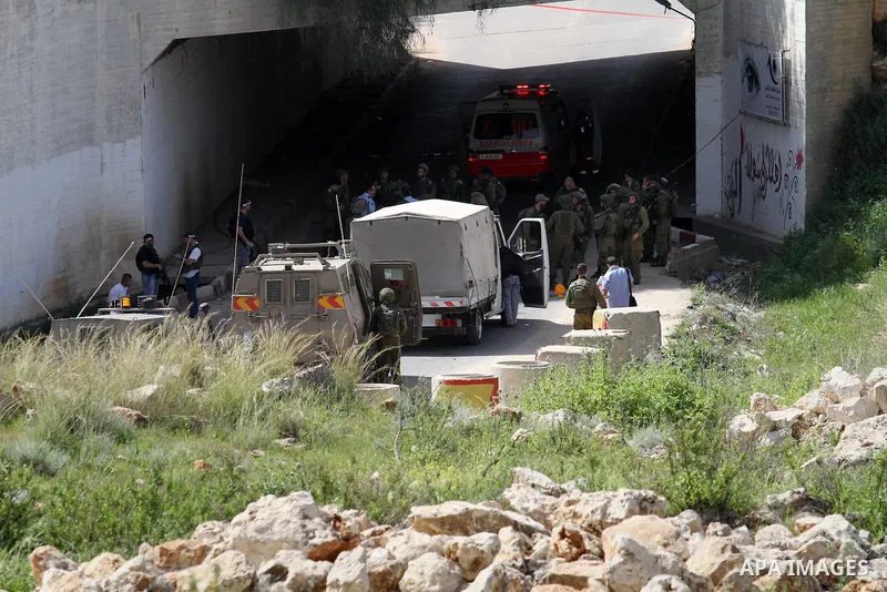 Israeli police gather at the scene of a stabbing attack in the West Bank village of Salfit, 09 March 2016. Israeli forces shot dead a 16-year-old Palestinian boy after he attempted to carry out a stabbing attack at a mil...