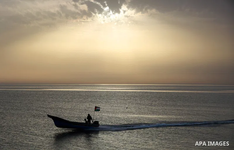 Palestininas ride a boat in the Mediterranean sea on the coast of Gaza city, on March 09, 2016. Photo by Yasser Qudih