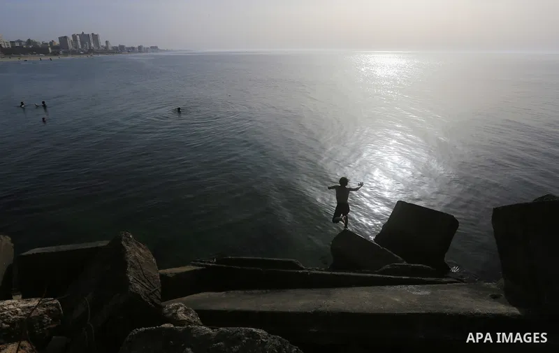 Palestininas swim in the Mediterranean sea on the coast of Gaza city, on March 09, 2016. Photo by Yasser Qudih