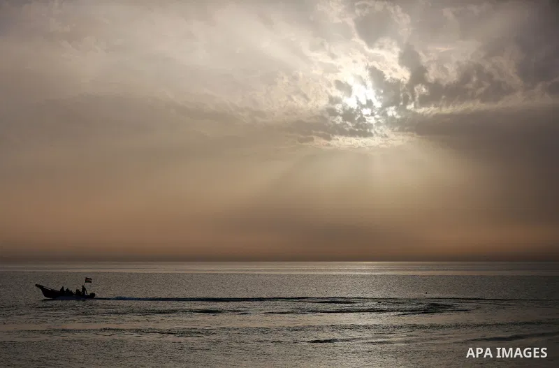 Palestininas ride a boat in the Mediterranean sea on the coast of Gaza city, on March 09, 2016. Photo by Yasser Qudih