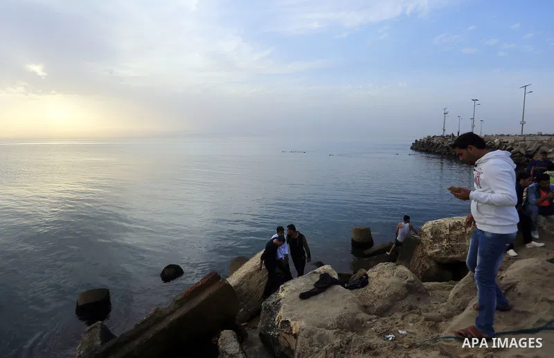 Palestinians enjoy a day at the beach of the Mediterranean sea on the coast of Gaza city, on March 09, 2016. Photo by Yasser Qudih
