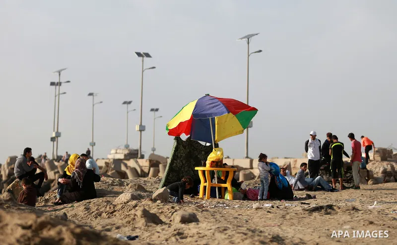 Palestinians enjoy a day at the beach of the Mediterranean sea on the coast of Gaza city, on March 09, 2016. Photo by Yasser Qudih