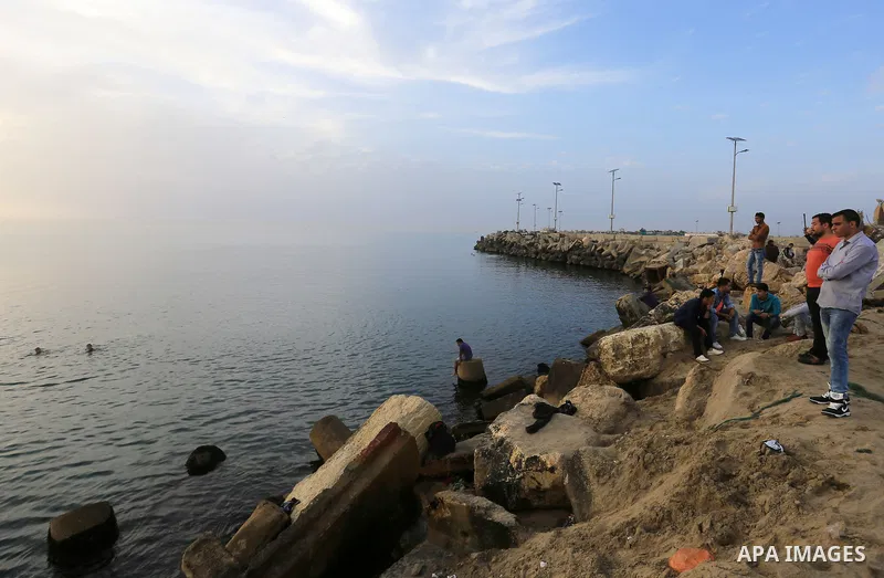 Palestinians enjoy a day at the beach of the Mediterranean sea on the coast of Gaza city, on March 09, 2016. Photo by Yasser Qudih