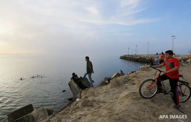 Palestinians enjoy a day at the beach of the Mediterranean sea on the coast of Gaza city, on March 09, 2016. Photo by Yasser Qudih